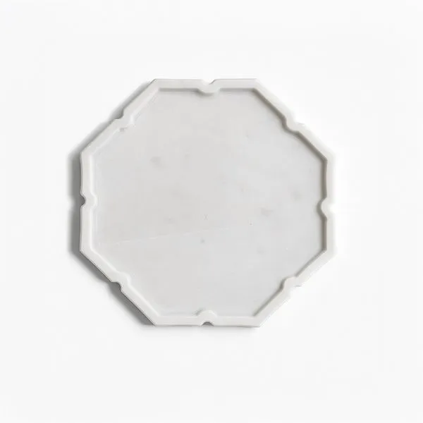 White marble tray with polished finish and lotus-inspired octagonal shape with soft scalloped edges