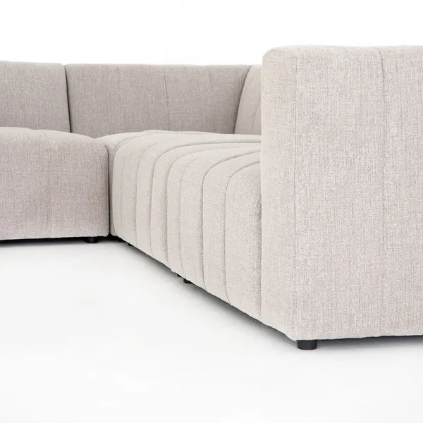 Langham six-piece sectional sofa in neutral sandstone fabric with left-facing chaise and wide channeling