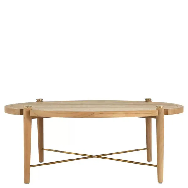 Round outdoor coffee table with natural teak wood slatted top and brass X-cross support under four tapered legs