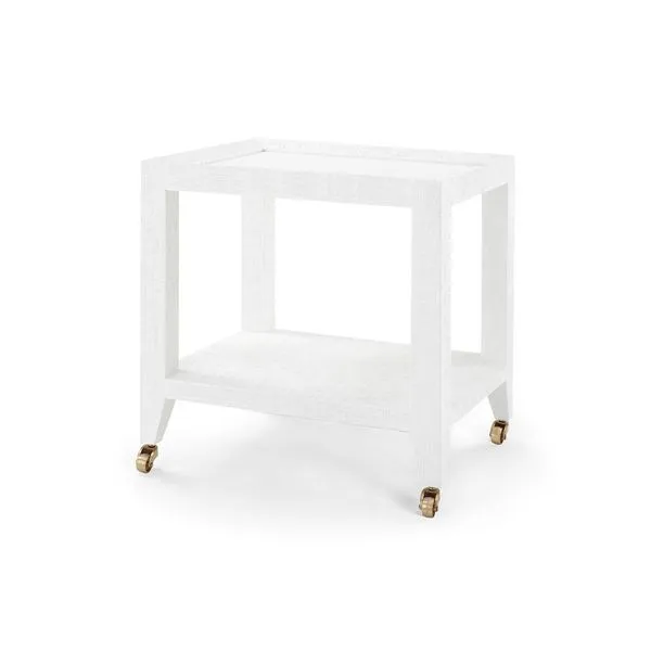 White lacquered Isadora Tea Table with open rectangular frame, lower shelf, and brass caster wheels