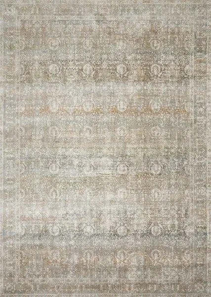 Ornate distressed traditional style rug with muted grey, beige, and subtle warm tones in a soft, faded pattern
