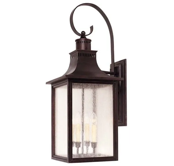 Monte Grande Wall Mount Lantern in English Bronze with pale cream seedy glass and a curved top arm