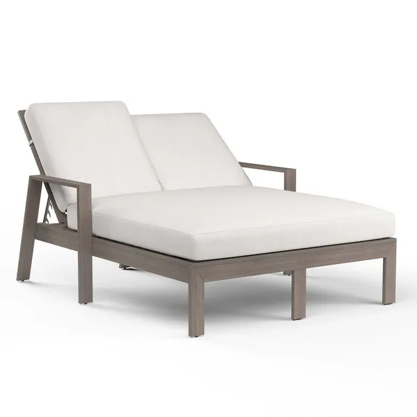 Laguna Double Chaise Lounge with hand-brushed aluminum frame mimicking driftwood and white backrest and seat cushions