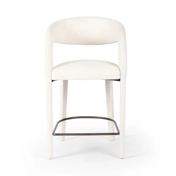 Hawkins Bar + Counter Stool with curved back and seat upholstered in high-performance off-white fabric, black metal footrest.