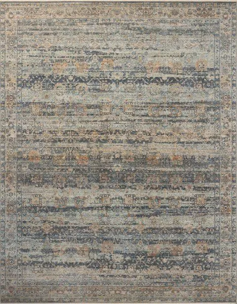 Traditional Heritage Sky / Sunset Rug with vintage-inspired motifs in muted blue, beige, and rust tones and variable-pile ...