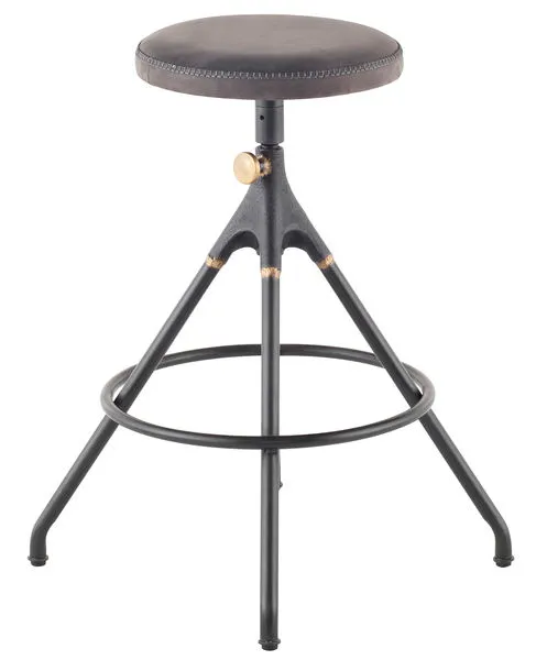 Akron counter stool with round dark leather seat, black cast-iron frame, brass adjustment knob, and circular footrest