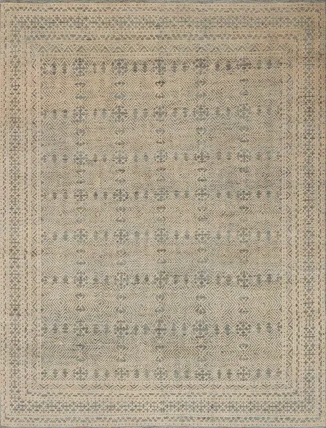 rectangular rug in blue and natural tones with intricate geometric and tribal-inspired pattern and bordered edges