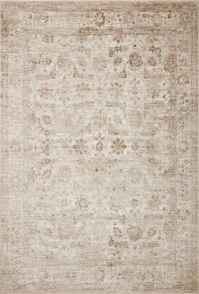 Traditional small rectangular rug in sand and taupe tones with a faded intricate pattern