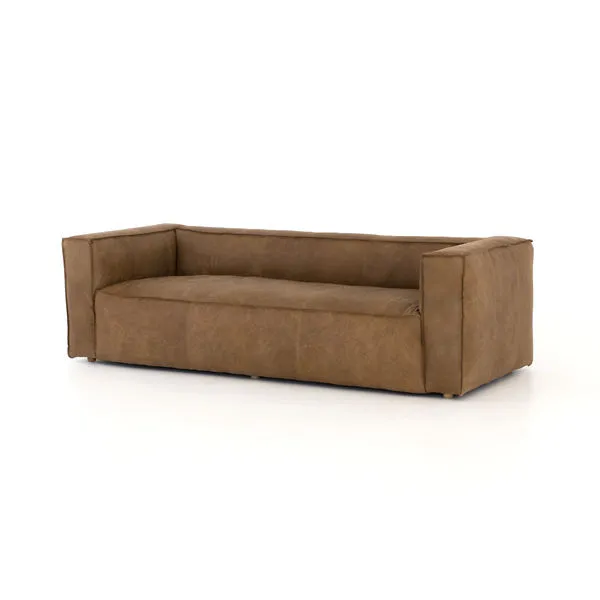 Nolita Reverse Stitch Sofa in natural sand-colored top-grain leather with contrast stitching on welt, low back and squared...