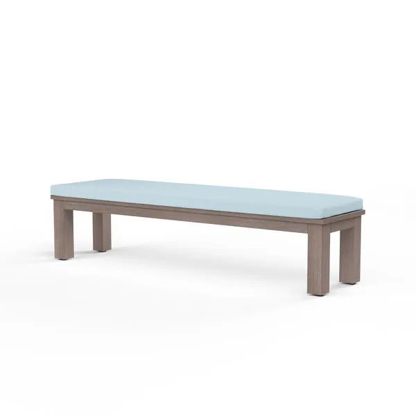Laguna Dining Bench with hand-brushed aluminum frame in driftwood finish and light blue cushioned seat