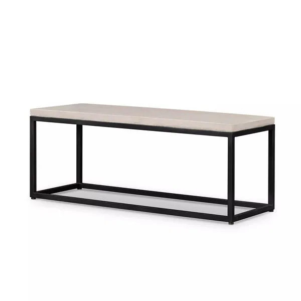 Four Hands Maximus Bench with rectangular light stone top and black metal frame base for outdoor use