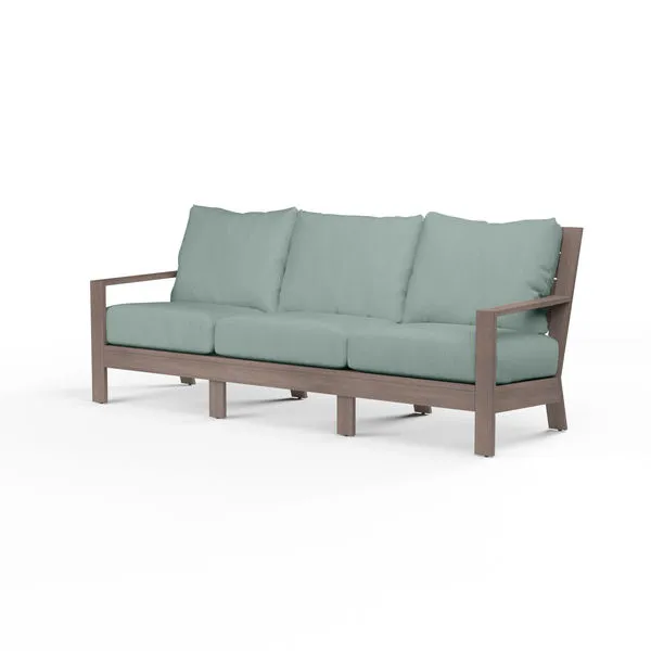 Laguna sofa with three-seat driftwood-finish aluminum frame and muted blue cushions