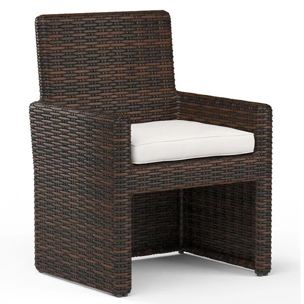 Montecito Dining Chair in rich Cognac multi-colored resin wicker with white seat cushion and armless design