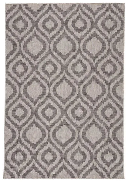 Gray indoor/outdoor rug with bold geometric ikat-inspired tile pattern in a versatile two-tone palette