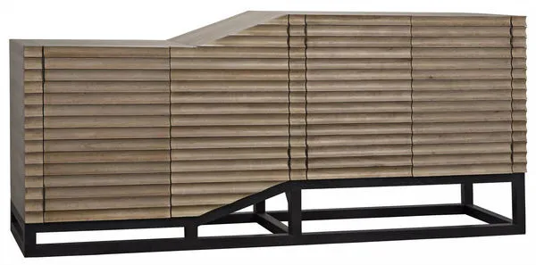 Esparta sideboard in walnut with minimally finished black metal base and carved linear detail on doors