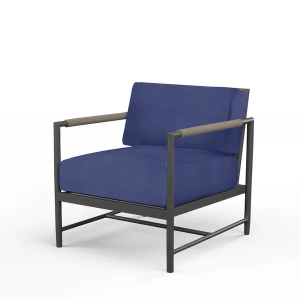 Pietra Club Chair in matte Graphite aluminum frame with blue cushioned seat and shale-colored rope armrests