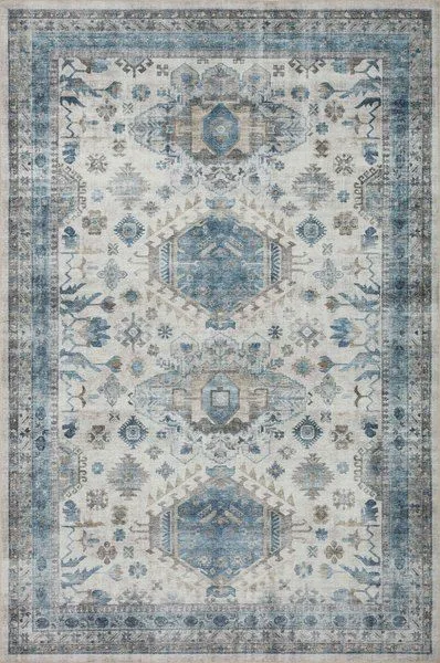 Heidi Ivory Ocean Rug with vintage-style blue and ivory medallion pattern and distressed border design