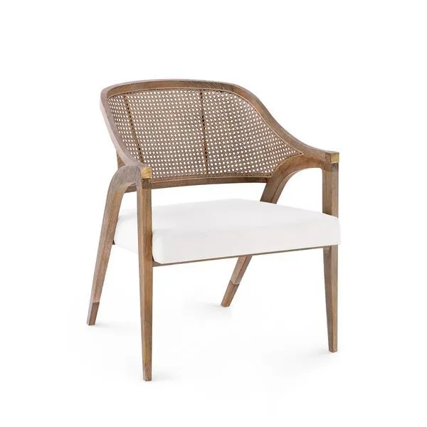 Three-quarter front view highlighting brass caps on chair corners and the tapered mahogany legs