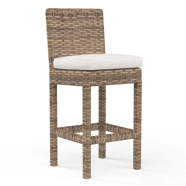 Outdoor counter stool with aged tobacco all-weather wicker frame and a white padded seat cushion