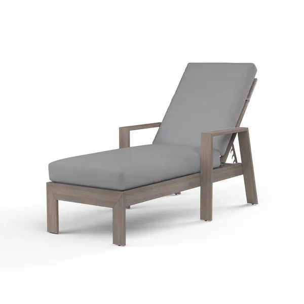 Laguna Chaise Lounge with hand-brushed aluminum frame mimicking driftwood and grey outdoor cushion