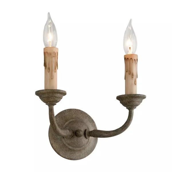 Cyrano Wall Sconce with two curved arms, rustic gray finish, and candle-style bulbs with faux wax drip detail