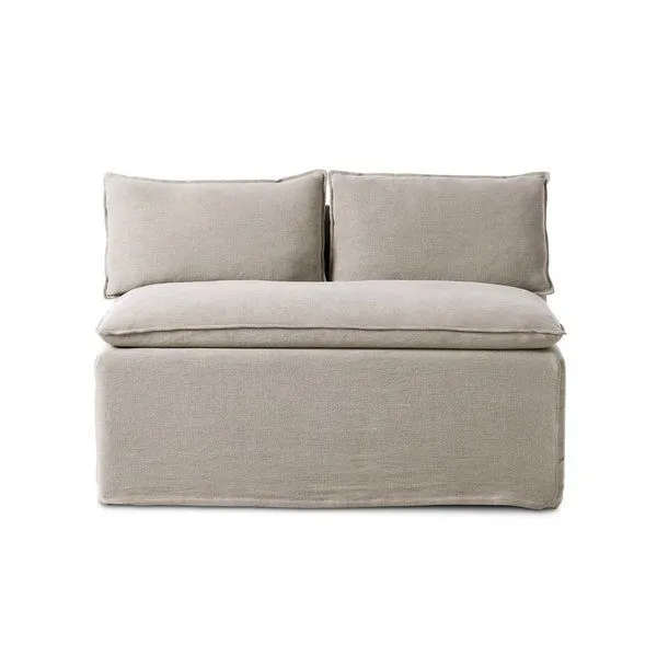 Armless slipcovered dining bench in neutral flax linen with feather-blend cushioning and flanged top seams