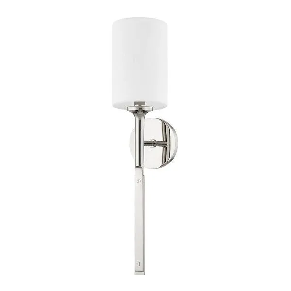 Polished nickel wall sconce with a slim metal stem and cylindrical white fabric shade, featuring faux nail head details