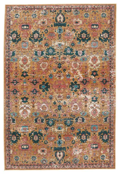 rectangular indoor/outdoor rug with a faded medallion design in warm pink, gold, turquoise, and cream tones