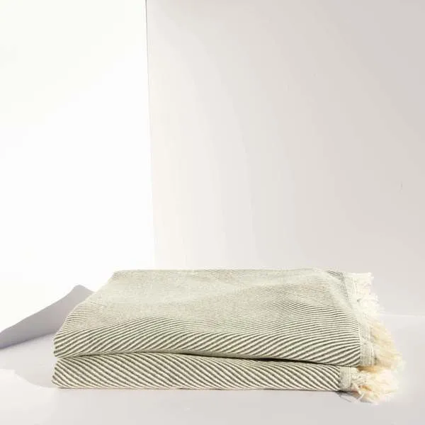 Jordan Bath Towel folded, olive color with subtle diagonal stripes and fringed edges