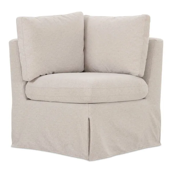 Fable slipcover dining corner banquette with beige washable fabric and inverted pleat skirt