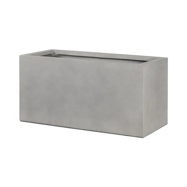 Rectangular monolithic outdoor planter made of smooth gray cast concrete with deep interior