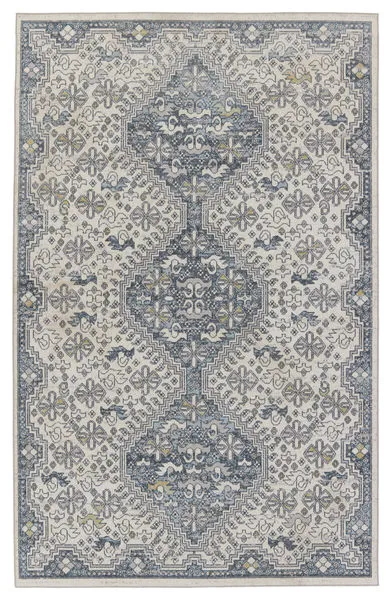 Cream and blue area rug with medallion and global inspired floral and geometric pattern