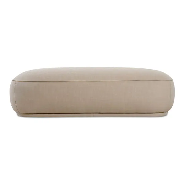 Marion Rectangular Ottoman with plump curved design, detailed piping, recessed base, upholstered in light beige fabric