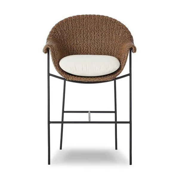 Outdoor bar stool with a curvy woven frame in brown and a white upholstered cushion on black iron legs