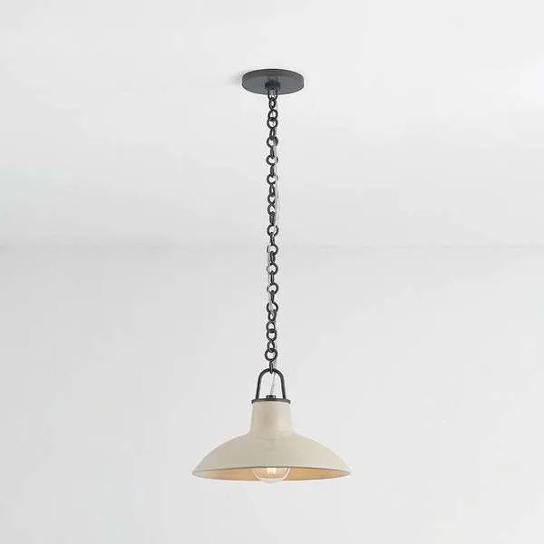 Cream-colored mid-century style Pottersville Pendant with wide dome ceramic shade and black chain suspension