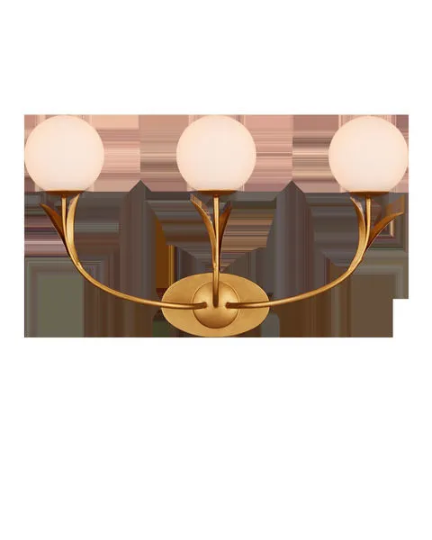 Rossville Triple-Light Wall Sconce in gold with three frosted white globe lights and thin arcing leaf details