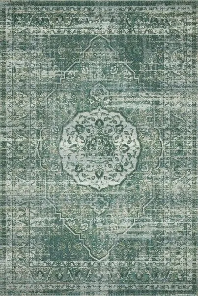 Rectangular power-loomed rug in shades of green and mist with textured abstract tribal medallion pattern