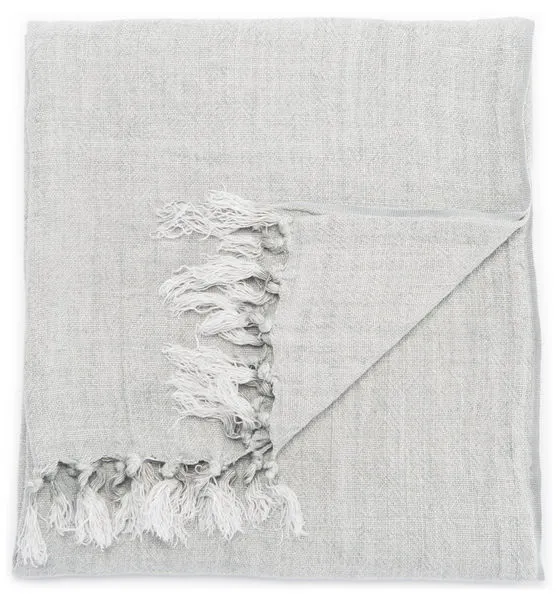 Solid gray linen throw blanket with a soft woven texture and fringe accents on one edge
