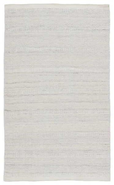 Parson indoor/outdoor area rug in light gray and ivory with subtle tribal patterns and textured weave