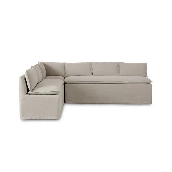 Modular L-shaped slipcover dining banquette in neutral flax linen with feather-blend cushioning and flanged seams