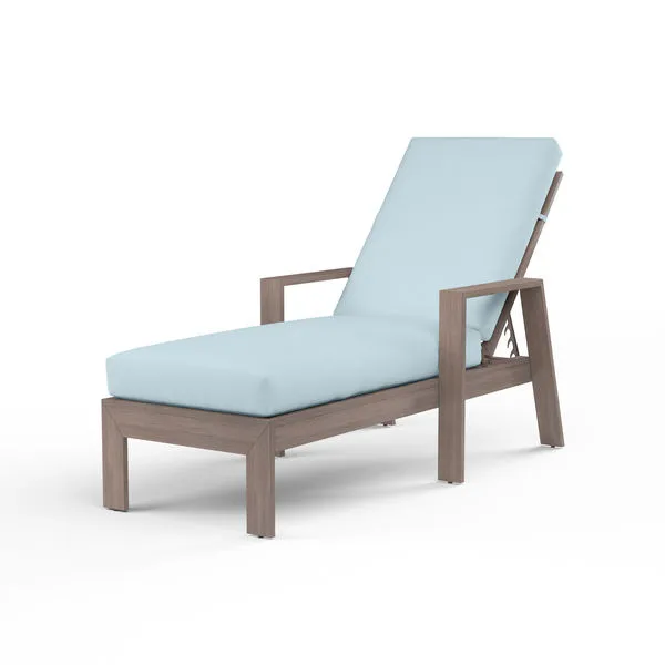 Laguna Chaise Lounge in hand-brushed aluminum frame mimicking driftwood with light blue outdoor cushions
