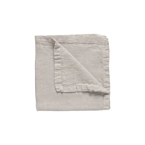 Cloud grey linen table runner folded to show soft texture and stitched borders with subtle ruffle detail
