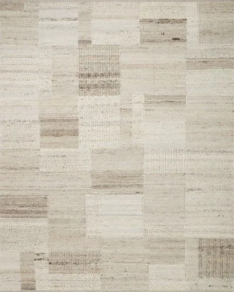 Natural-toned Manfred rug with a patchwork of high-low wool textures in beige and cream shades