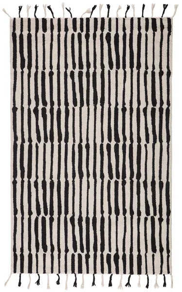 Hand tufted black and ivory wool rug featuring bold vertical tribal-inspired stripes and knotted fringe ends