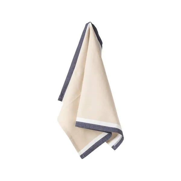 Beige kitchen towel with dark blue and white border hanging loosely
