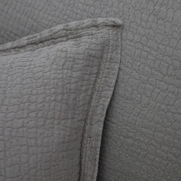 Close-up of textured wavy pebbled fabric and flange detailing on Waverly Duvet Set pillow
