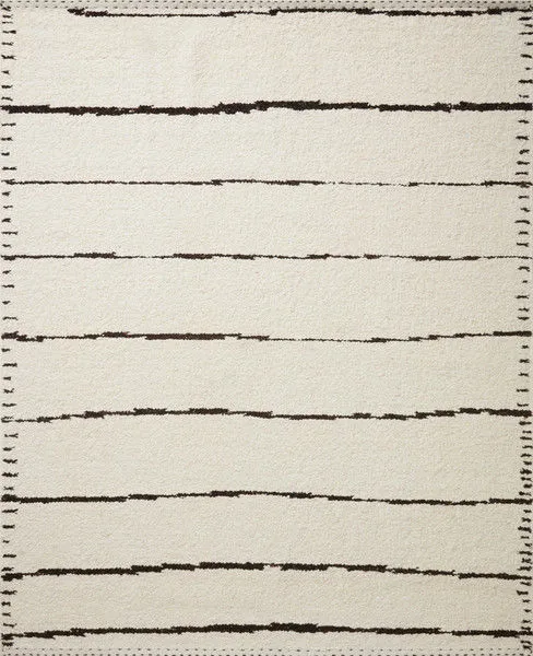 Rectangular ivory rug with irregular black horizontal lines and stitched black edge in a minimal modern style