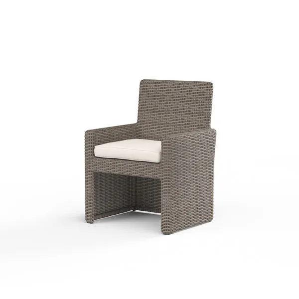 Coronado Dining Chair in Driftwood resin wicker with plush cream cushion and straight, transitional lines
