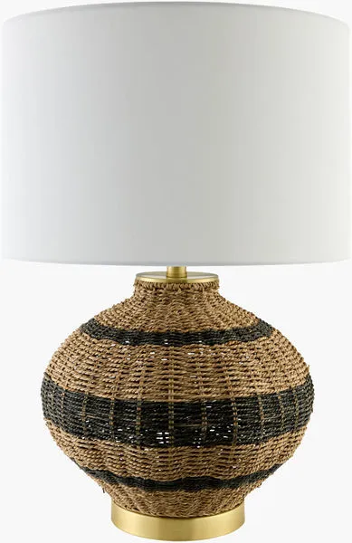 Round rattan accent table lamp with black horizontal stripes, white linen shade, and brass base