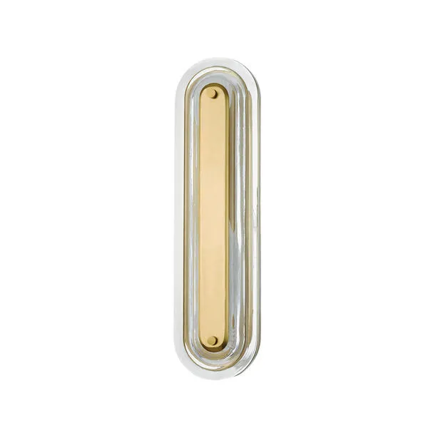 Slim vertical wall sconce with aged brass center bar surrounded by clear glass frame in rounded rectangle shape